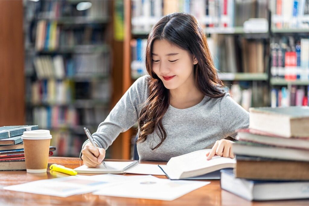 woman, writing, library-8601818.jpg